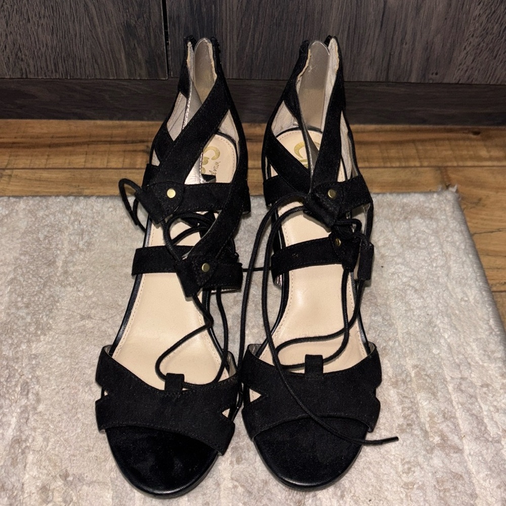 Lace up black heels with gold zipper down the back